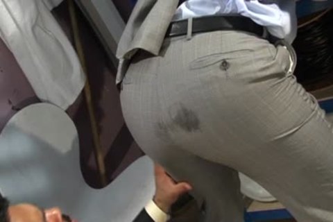 Plowing hard muscle amateur in a suit outdoors